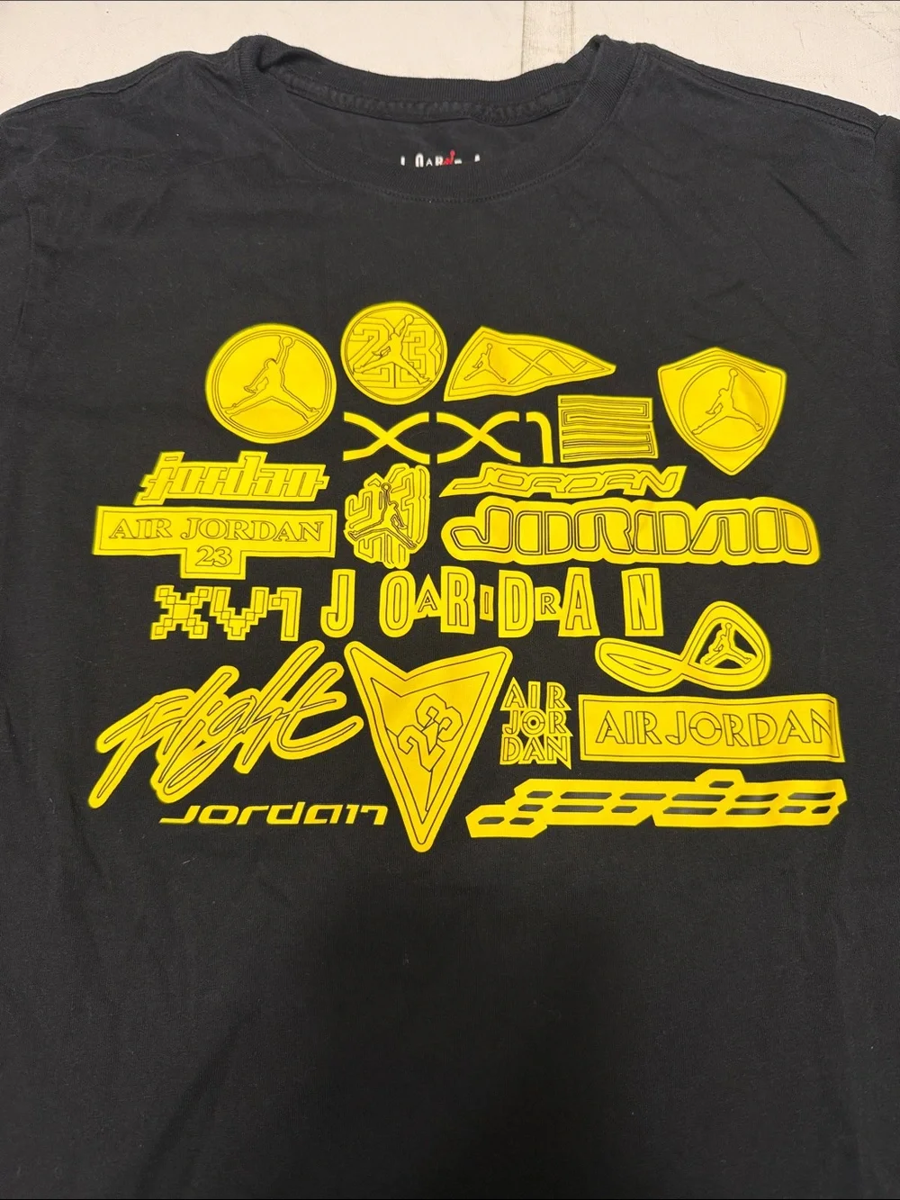 Jordan Short Sleeve Crew Tee in Black with Yellow Logo Graphics